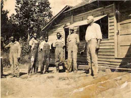 Outside the building containing the Jones family mineral springs in 1930, from right to left: Wesley Jones, Jr., Mark Jones (Wesley's son), Benjamin Jones (Wesley's son)br / Wesley's nephews (Daniel &amp; Willie Taylor),br / unknown. Photo: Courtesy of Ray Jones.