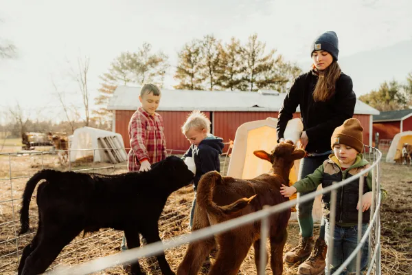 “Our 3-year-old comes out to milk no matter the weather,” Whitney Belprez said. “His ‘pay’ is the hot chocolate packet he brings out in his mug so he can pick the cow he wants to milk. Our kids have been a part of this their whole lives.” Credit: Photo courtesy of the Diocese of Lansing