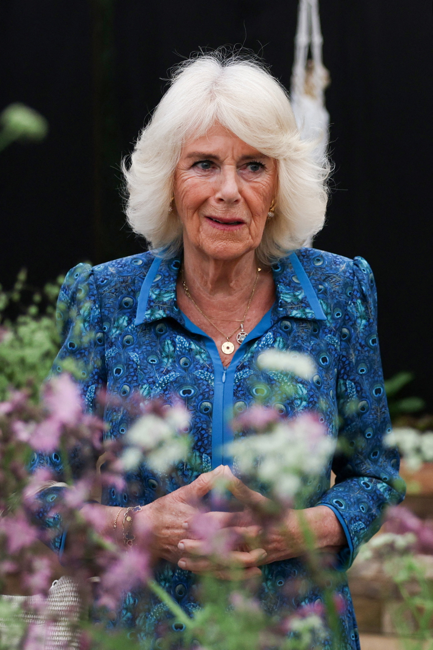 Queen Camilla, pictured here at the 111th RHS Chelsea Flower Show on Monday, has previously said gardening is a form of 'therapy'